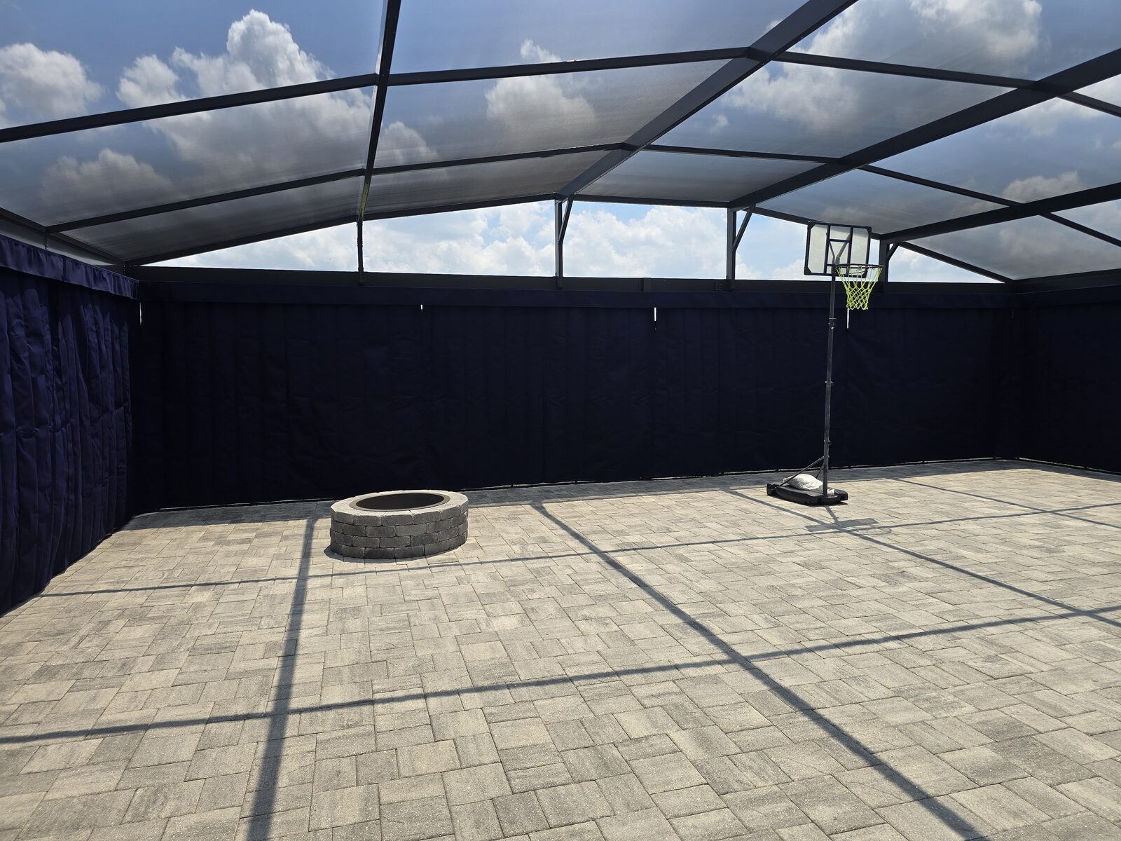 Navy privacy curtains on a screened patio