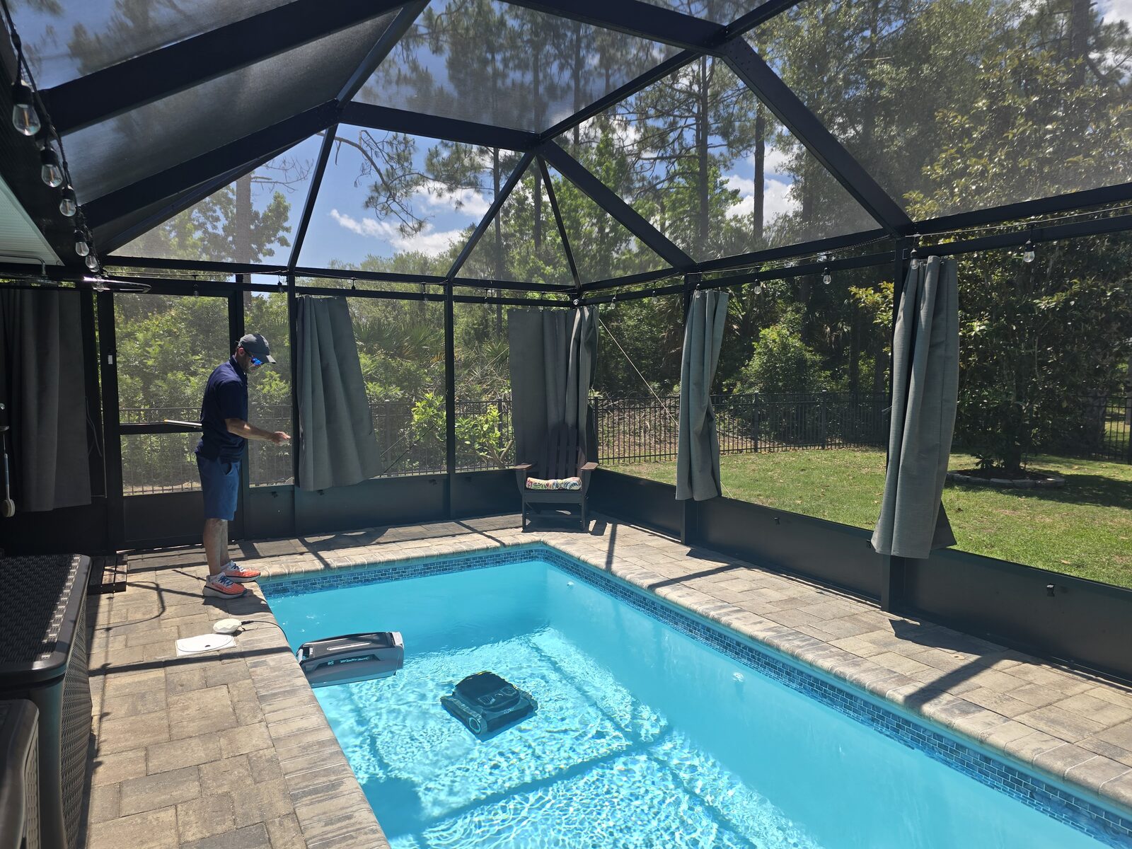 A distributor installing outdoor privacy curtains