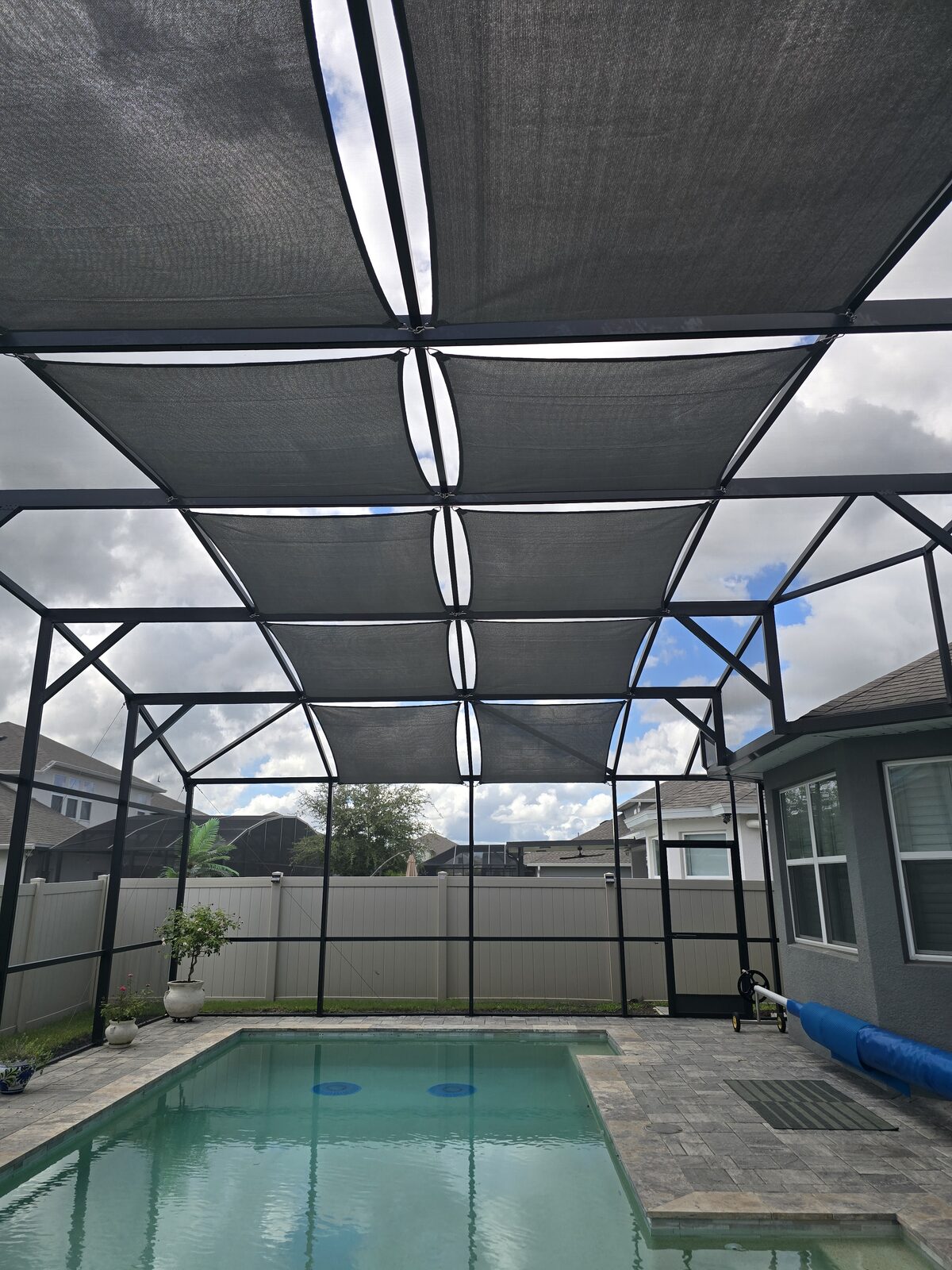 SolaMesh shade sails on a Florida pool cage