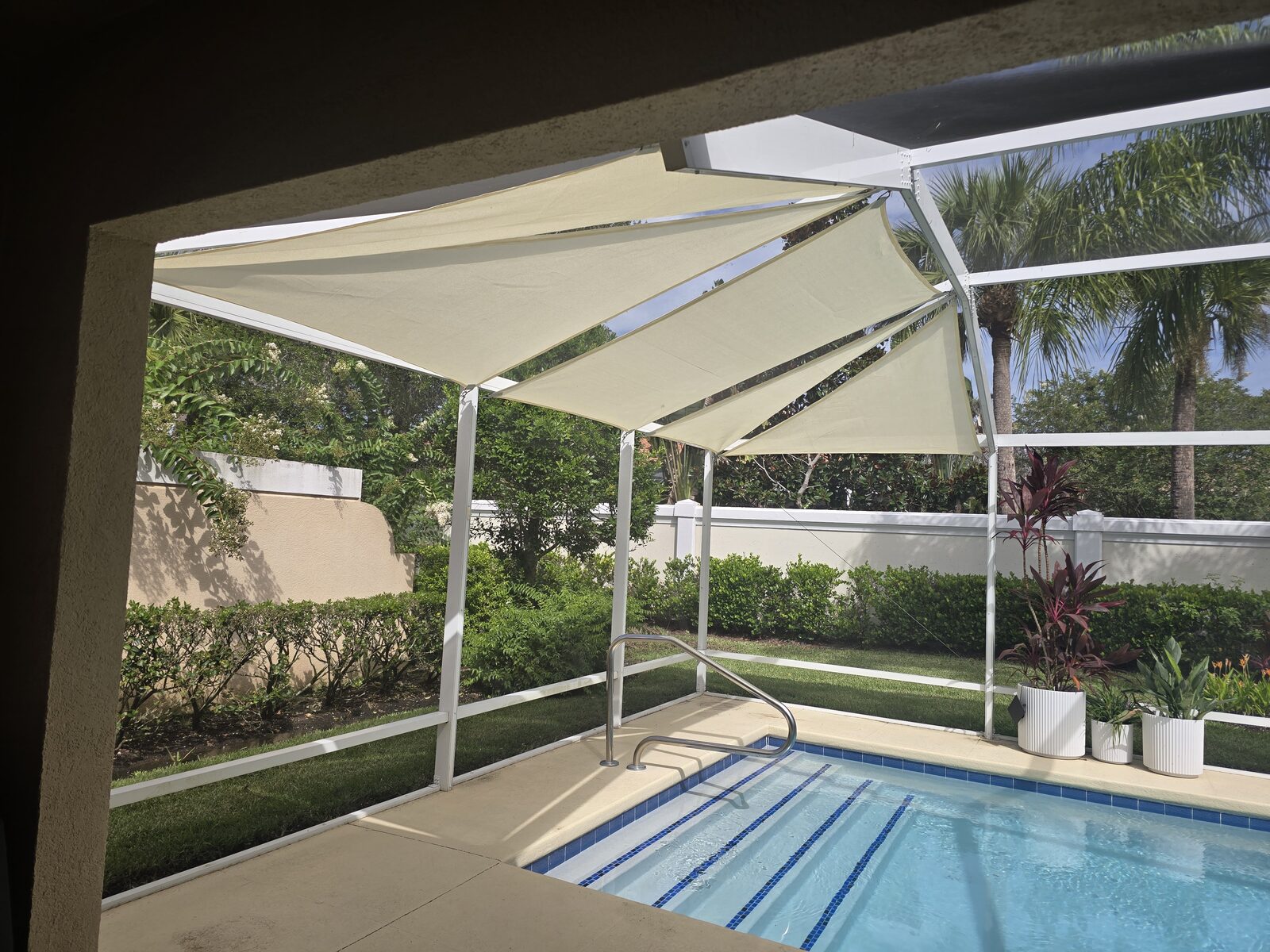 Custom shade sails over an outdoor living space