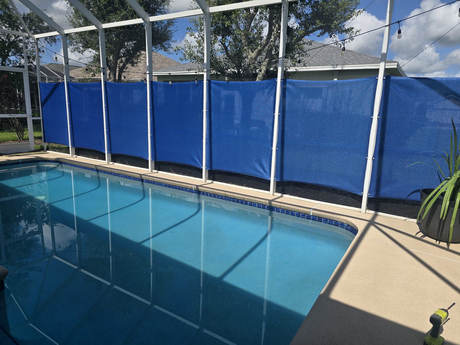 SolaMesh shade sails on a screened lanai